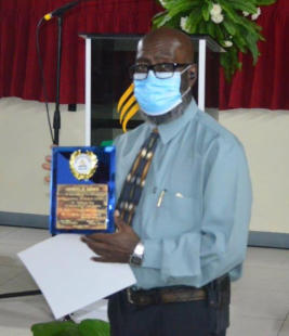 Plaque awarded to Media Director & Communication Secretary,Orphiel Brown, for over ten years of service to the Church & Department